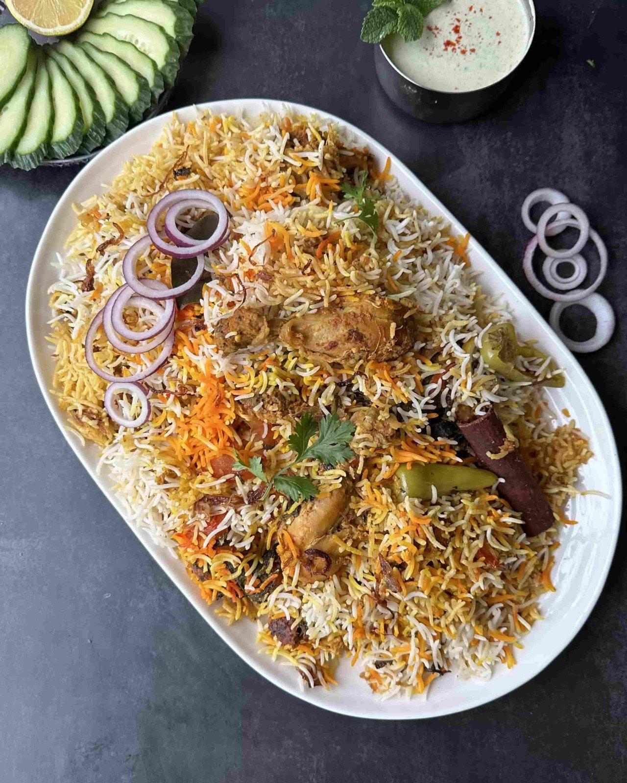 Chicken biryani, layered with basmati and whole spices